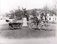 “Old Forgotten” ....Shown on P.T. Barnum Square, around the Doughboy, is  “Old Forgotten” Bethel’s first piece of fire apparatus. This hand-drawn pumper can be found in the South St Fire Dept. Museum.  Also shown is a hand-drawn hose wheel.
